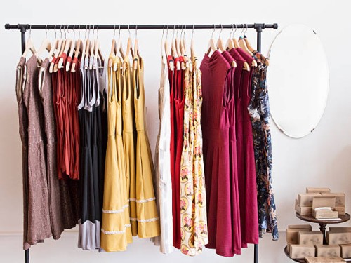 rack of dresses in boutique - fashion stock pictures, royalty-free photos & images