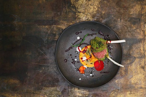 rack of lamb with herb coating and vegetable mousse - food stockfoto's en -beelden