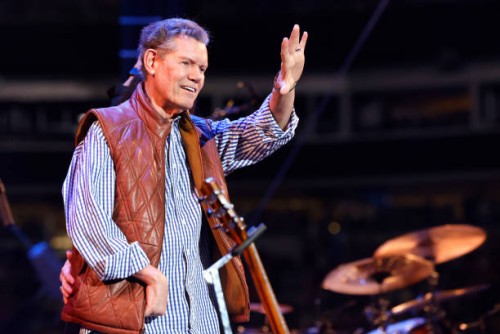 Randy Travis waves to the audience at the Concert For Carolina Benefit Concert at Bank of America Stadium on October 26, 2024 in Charlotte, North...