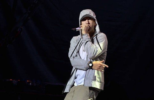 Rapper Eminem performs on August 22, 2013 during a concert at the Stade de France in Saints-Denis, near Paris. AFP PHOTO / PIERRE ANDRIEU