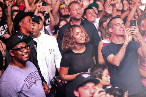 Rapper Jay-Z, singer Beyonce and Los Angeles Mayor Eric Garcetti are seen watching Steve Aoki's set during day 2 of the Made in America Festival at...