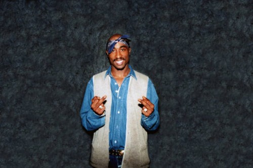 Rapper Tupac Shakur poses for photos backstage after his performance at the Regal Theater in Chicago, Illinois in March 1994.