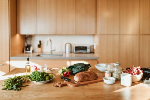 raw food and ingredients on kitchen island at home - food stock pictures, royalty-free photos & images