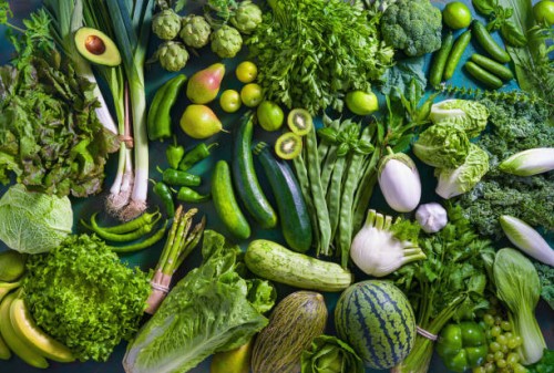 raw fruits and vegetables vegan food on monochrome green table full frame - food stock pictures, royalty-free photos & images