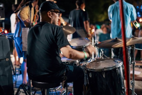 rear view of a drummer at a outdoor music festival - concert stock pictures, royalty-free photos & images