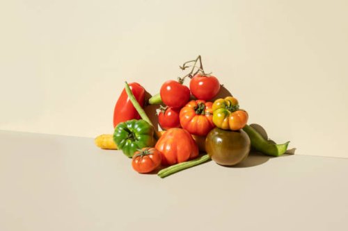 red,green tomatoes, carrots and green beans on the beige background - food stock pictures, royalty-free photos & images