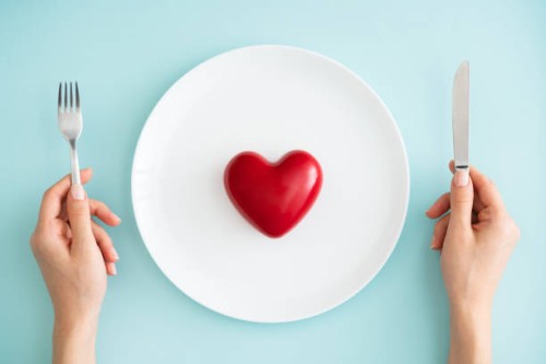 red heart on white plate - food stock pictures, royalty-free photos & images
