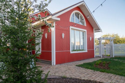 red house with string lights by trees in back yard - garden decoration stock pictures, royalty-free photos & images