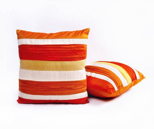 red orange and white throw pillows on a white background - home decoration stock pictures, royalty-free photos & images