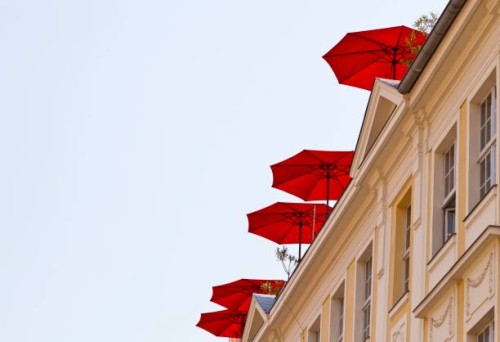 red umbrellas on a roof terrace, potsdam, brandenburg, germany - garden decoration stock pictures, royalty-free photos & images