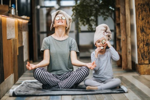 relaxed mother and daughter exercising yoga in the morning at home. - food stock pictures, royalty-free photos & images