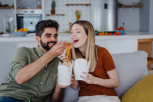 relaxed weekend at home and ordering food - junk food stock pictures, royalty-free photos & images