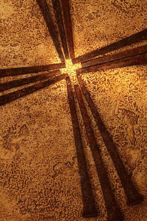 religious: cross of old square rusty nails on gold background - nails art stock pictures, royalty-free photos & images