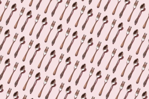 repeated spoon and fork on the pink background - food stock pictures, royalty-free photos & images