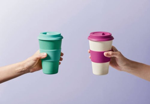 reusable coffee cup in hand - junk food stock pictures, royalty-free photos & images