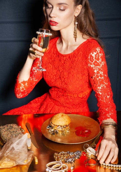 rich woman drinking champagne and eating fast food - junk food stock pictures, royalty-free photos & images