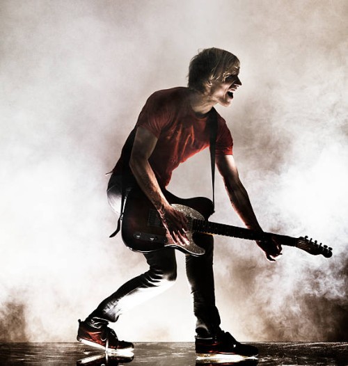 rock star with his guitar. - concert stock pictures, royalty-free photos & images