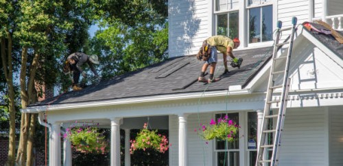 roofing contractors replacing damaged roofs after a hail storm - home decoration stock pictures, royalty-free photos & images