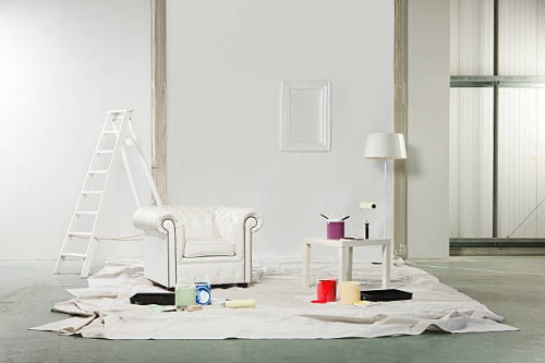 room with paint pots and white armchair - home decoration stock pictures, royalty-free photos & images