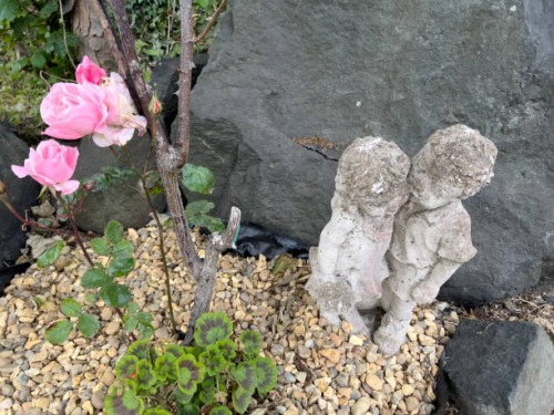 rose plant and sculpture - garden decoration stock pictures, royalty-free photos & images