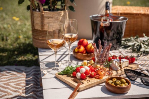 rose wine glasses with antipasti picnic food snacks on sunny garden party table - food stock pictures, royalty-free photos & images