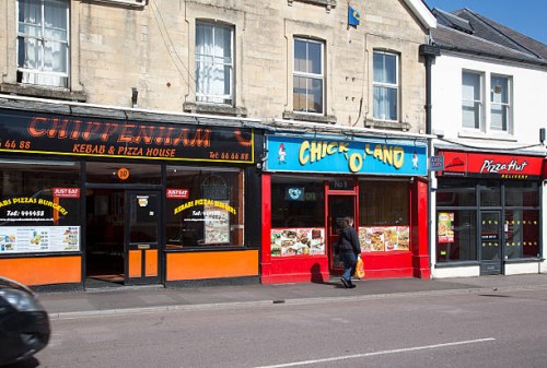 Row of fast food take-away restaurant shops, Chippenham, Wiltshire, England, UK.
