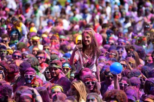 Runners attend a DJ concert after finishing the Burdi Colors race on May 5, 2018 in Pessac, southwestern France. The Burdi Colors is a 5 km race with...