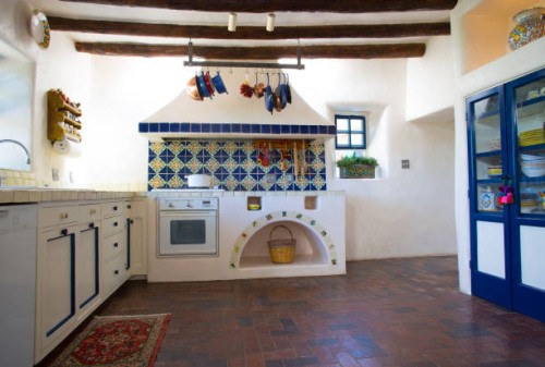 rustic southwest usa kitchen: brick floor, beams, oven, counters - home decoration stock pictures, royalty-free photos & images