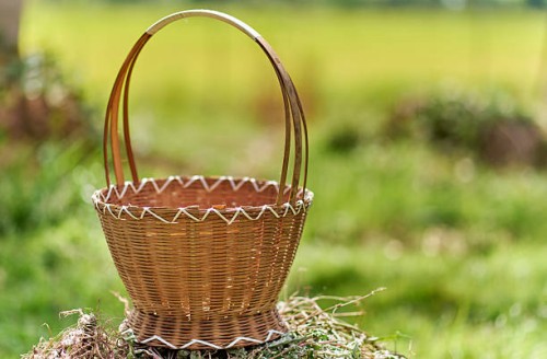rustic wicker basket on grass in natural light - garden decoration stock pictures, royalty-free photos & images