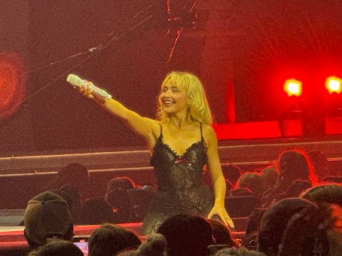 Sabrina Carpenter onstage in Houston at Toyota Center as part of her Short n' Sweet Tour.