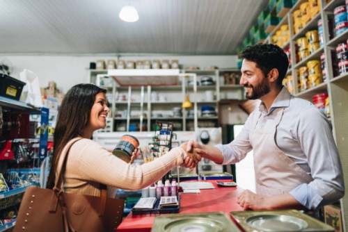 salesman and customer greeting at building material store - home decoration stock pictures, royalty-free photos & images