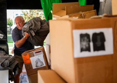 Sam Love unpacks Beyoncé merchandise as fans line up before the artists two weekend concerts at NRG Stadium, Saturday, Sept. 23 in Houston.