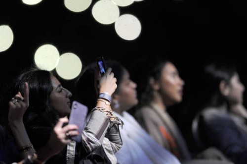 Saudi women take a selfie as they attend a concert by Egyptian pop sensation Tamer Hosny in the western city of Jeddah on March 30, 2018. - Thousands...