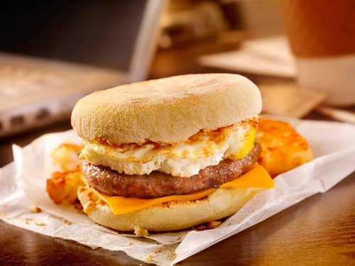 sausage and egg breakfast sandwich at your desk - junk food stock pictures, royalty-free photos & images