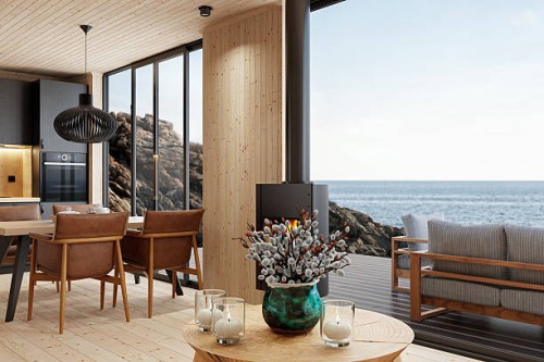 scandinavian log cabin interior with open space and sea view - home decoration stock pictures, royalty-free photos & images