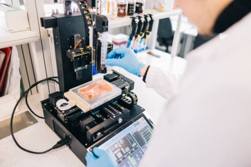 scientist setting up bio-ink printer - food stock pictures, royalty-free photos & images