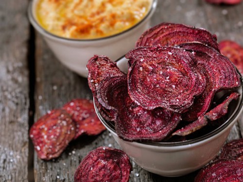 sea salted beet chips with a hummus dip - junk food stock pictures, royalty-free photos & images