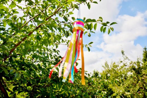 self-made wind chime hanging in a tree, decoration for garden party in summe - garden decoration stock pictures, royalty-free photos & images