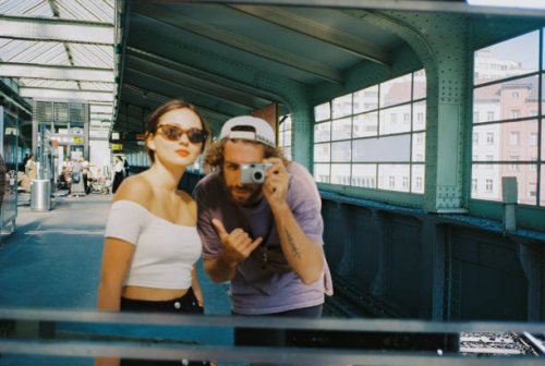 selfie of young couple in the mirror shot on point and shoot film camera - travel stock pictures, royalty-free photos & images