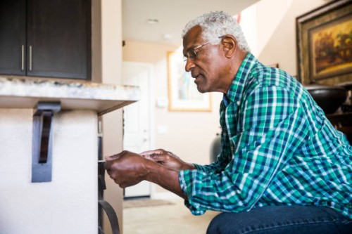 senior black man home repairs - home decoration stock pictures, royalty-free photos & images