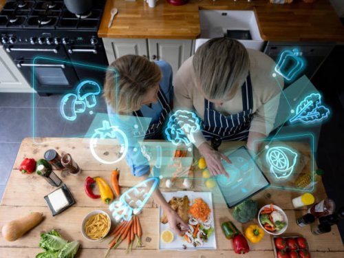 senior couple cooking at home and using technology to do a calorie count - food stock pictures, royalty-free photos & images