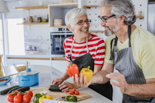senior couple cooking together at home - food stock pictures, royalty-free photos & images