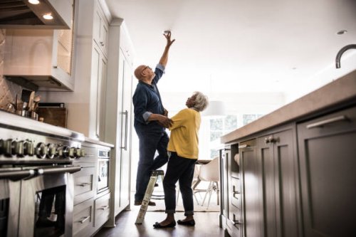 senior couple couple doing diy project at home - home decoration stock pictures, royalty-free photos & images