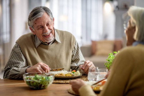 senior couple enjoying dinner together - food stock pictures, royalty-free photos & images