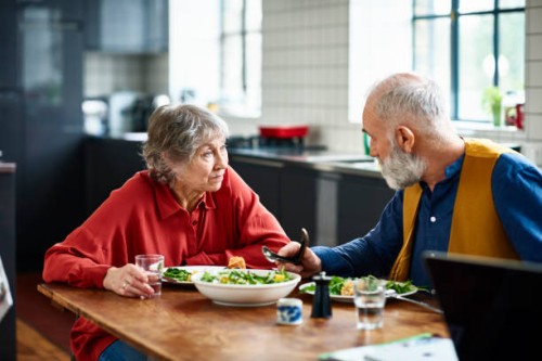 senior couple having serious discussion over lunch at home - food stock pictures, royalty-free photos & images