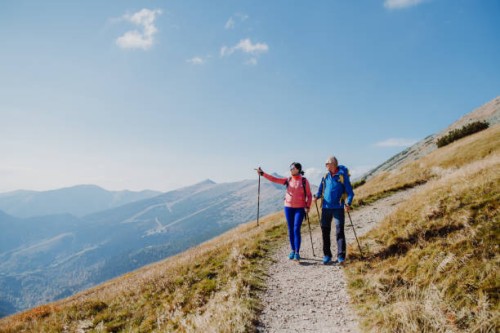senior couple hiking together. - travel stock pictures, royalty-free photos & images
