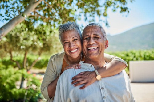 senior couple, smile and outdoor in nature park showing love, care and happy on a retirement holiday on summer day. portrait of elderly man and woman together for fresh air and tree view on vacation - travel stock pictures, r
