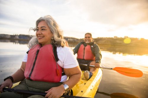 senior hispanic couple kayaking - travel stock pictures, royalty-free photos & images