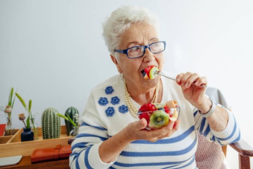 senior woman at home - food stock pictures, royalty-free photos & images