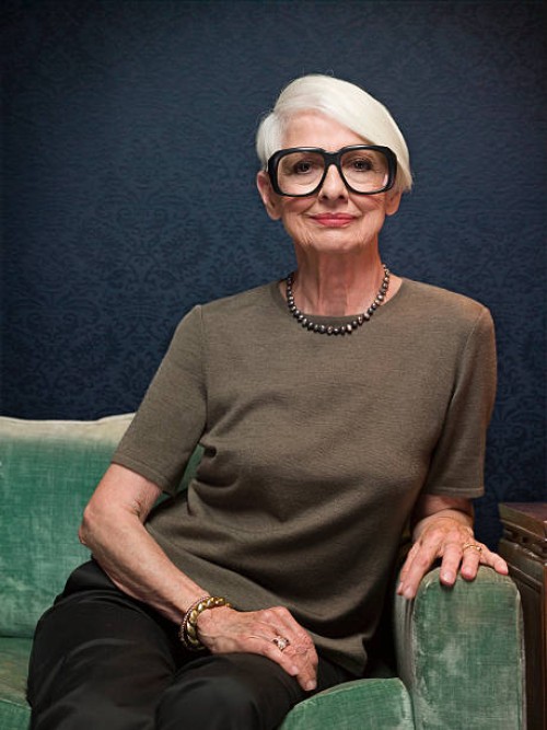 senior woman sitting on sofa wearing oversized glasses, portrait - fashion stock pictures, royalty-free photos & images